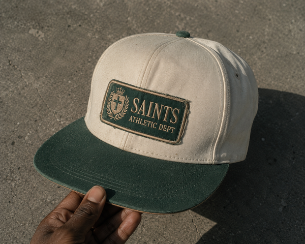 Saints Only Trucker Cap — structured adjustable cap, Drop 001