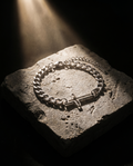 Tether — silver curb chain, single cross station