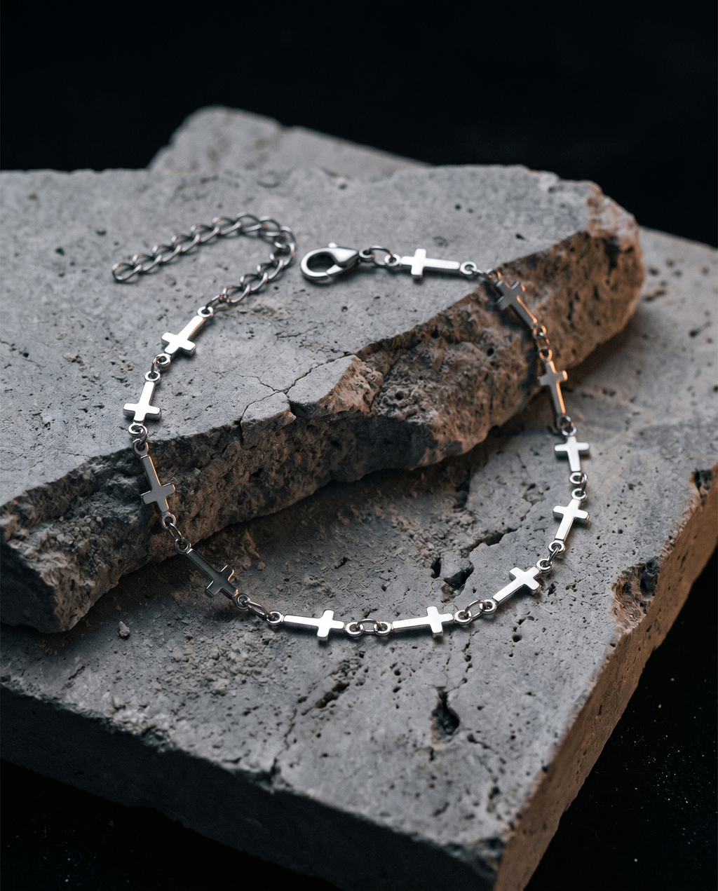 Relentless — silver row of small plain crosses