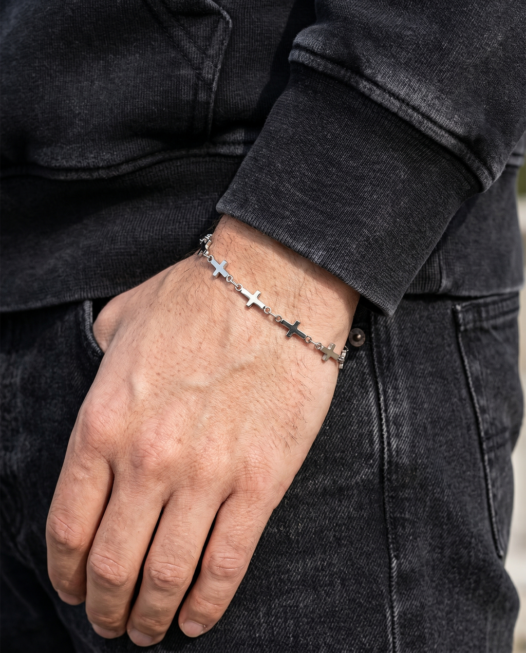 Relentless — silver row of small plain crosses