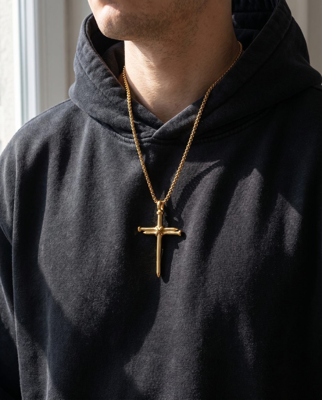 The Nails — gold cross formed of crossed nails