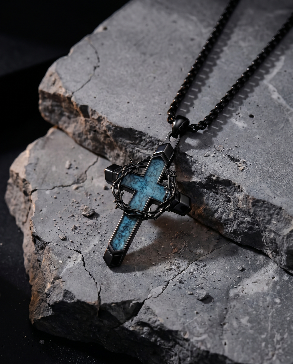 Wellspring — black thorn-cross split by blue stone