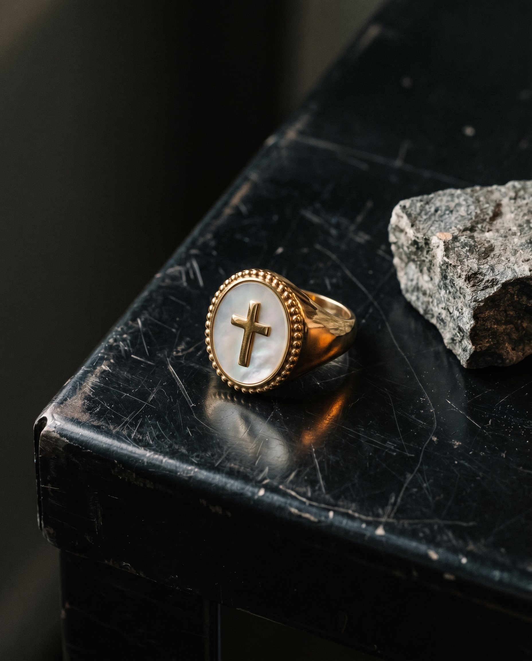 Inri — gold oval plaque, thin cross on mother-of-pearl