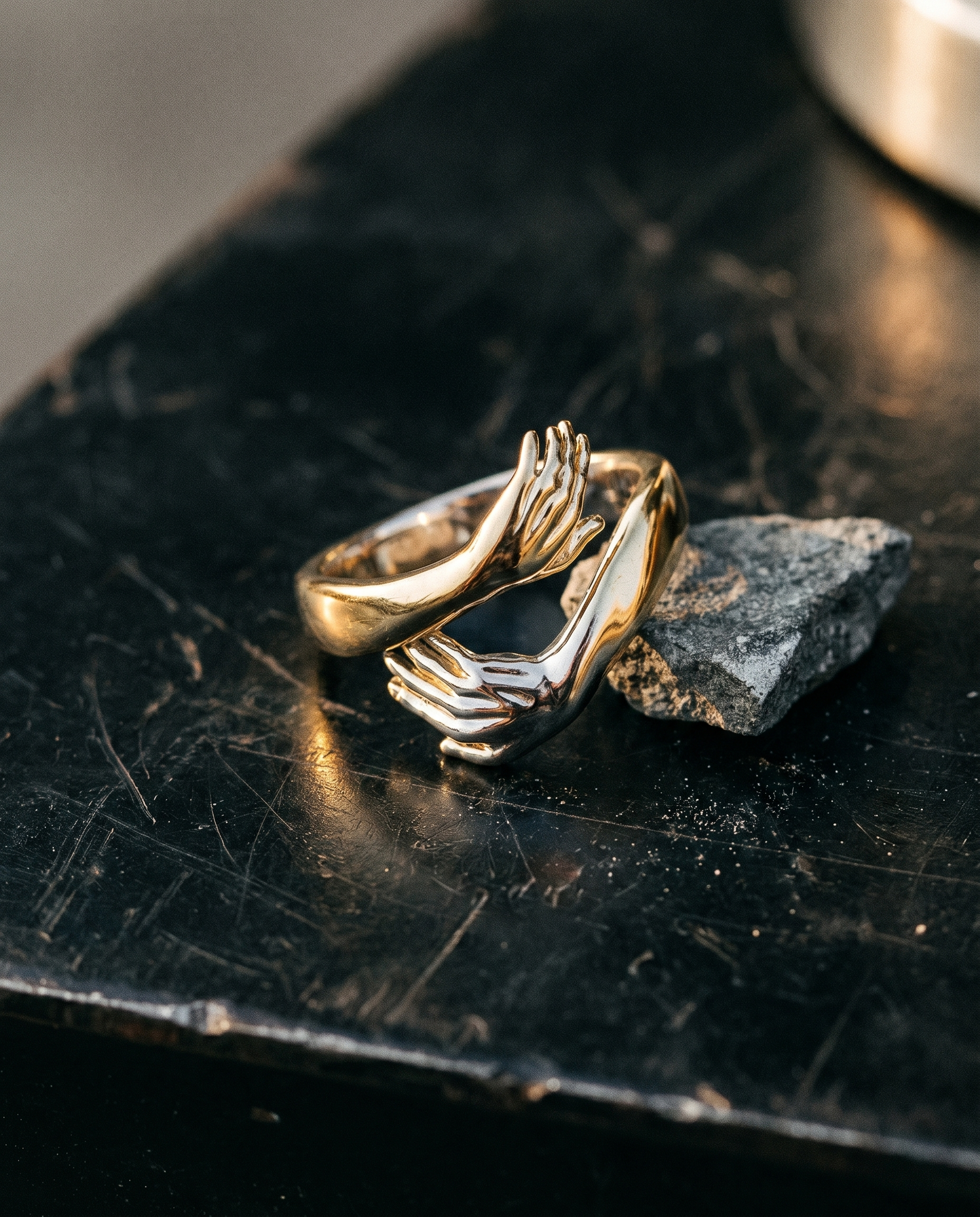 Covenant — gold sculptural band, TWO HANDS clasping