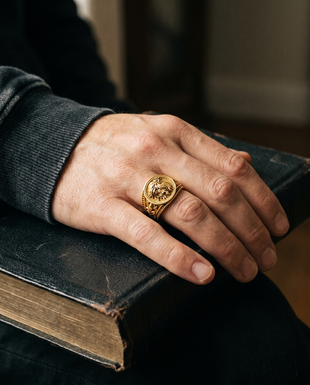 Conqueror — gold oval signet, roaring LION head